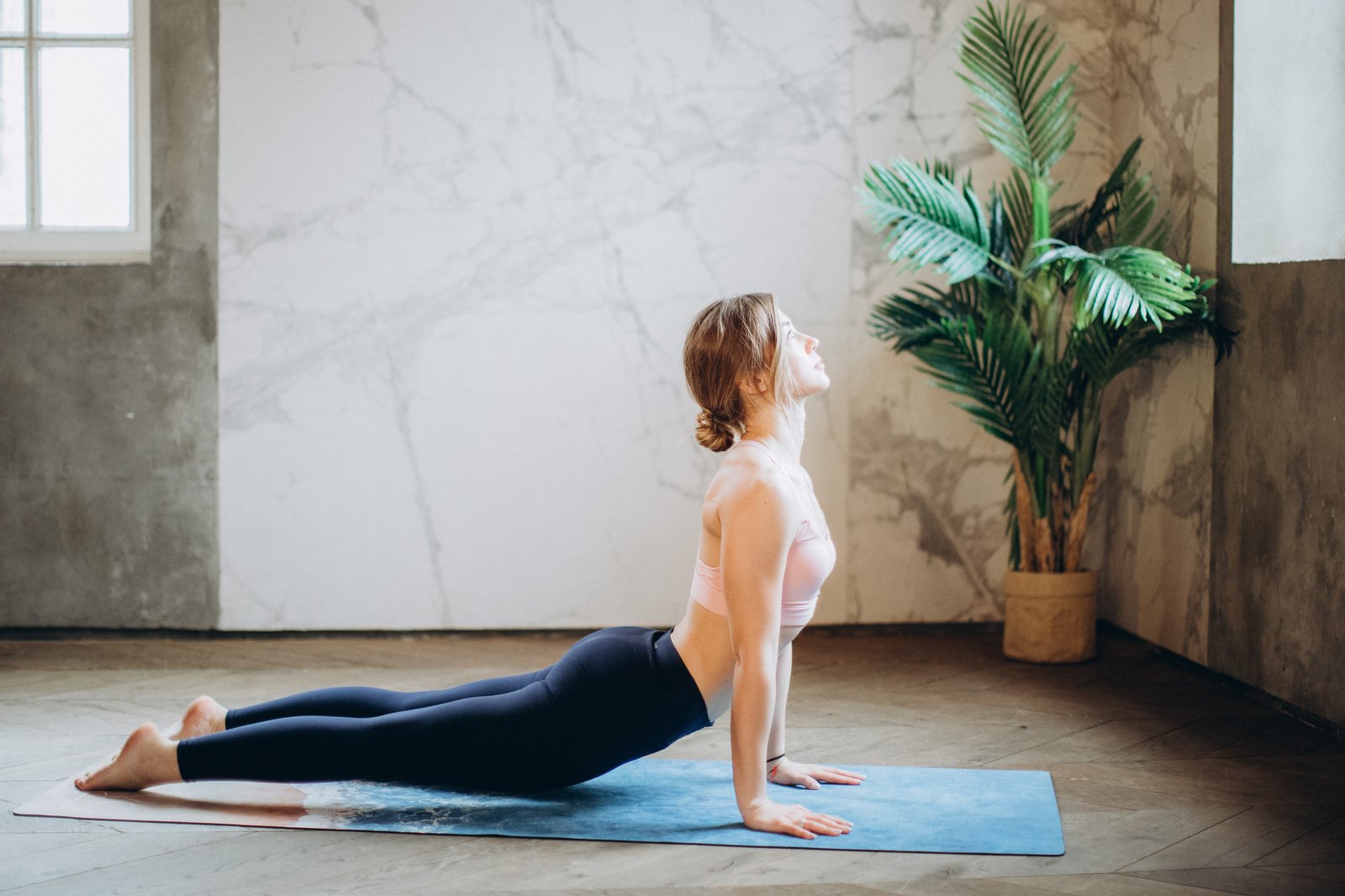woman-doing-yoga-exercise-for-each-stage-of-your-menstrual-cycle