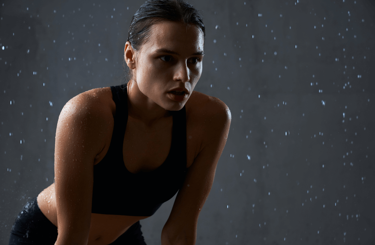 Woman sweating after working out - under boob sweat