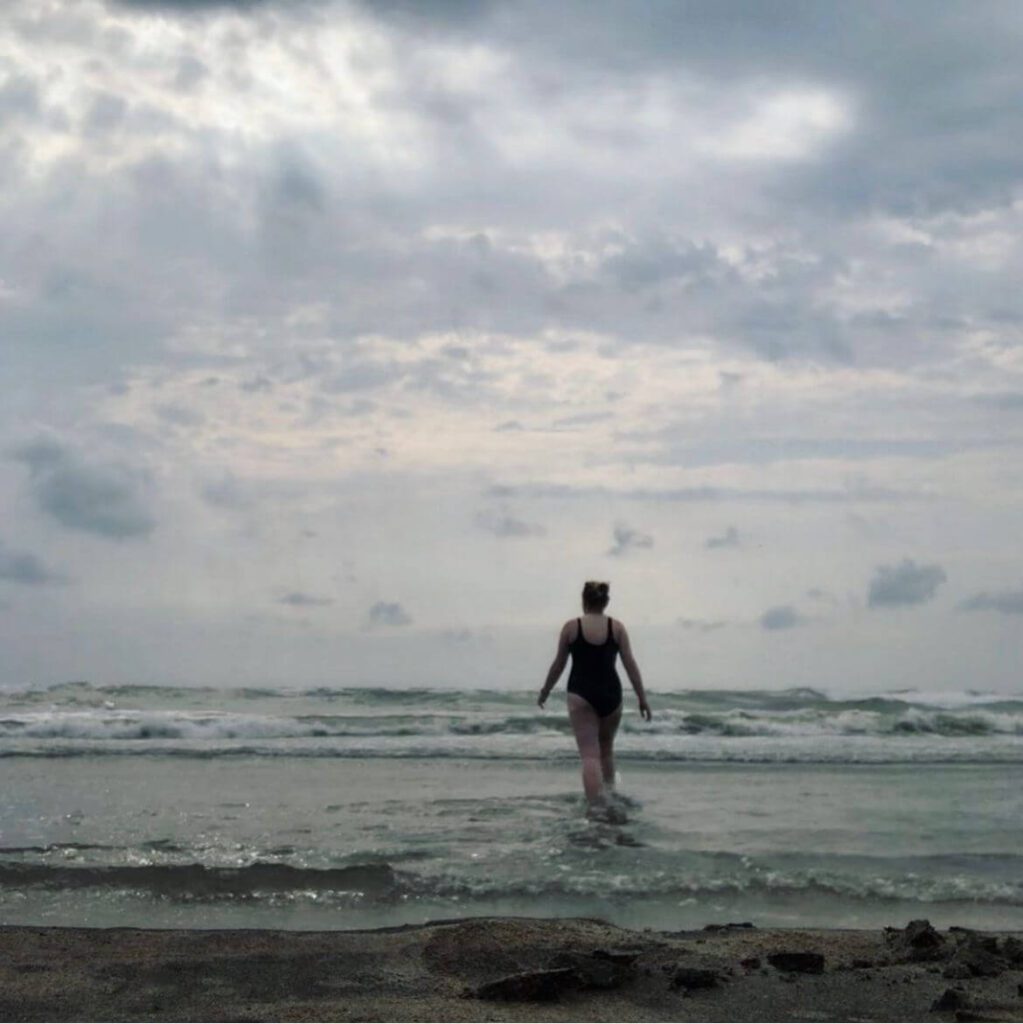 Female Solo Traveller Lucy Robinson in the Sea Swimming Alone - Top Solo Travel Tips