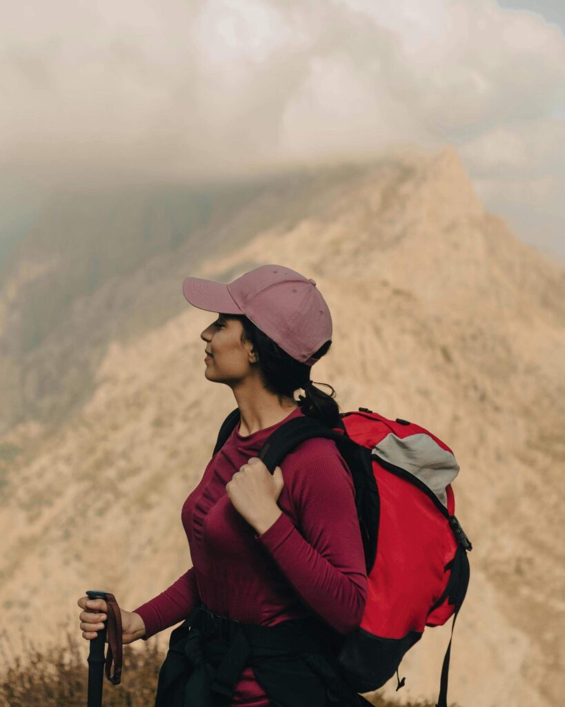 Adventure Travel - Female Solo Traveller Trekking Up Mountain Alone