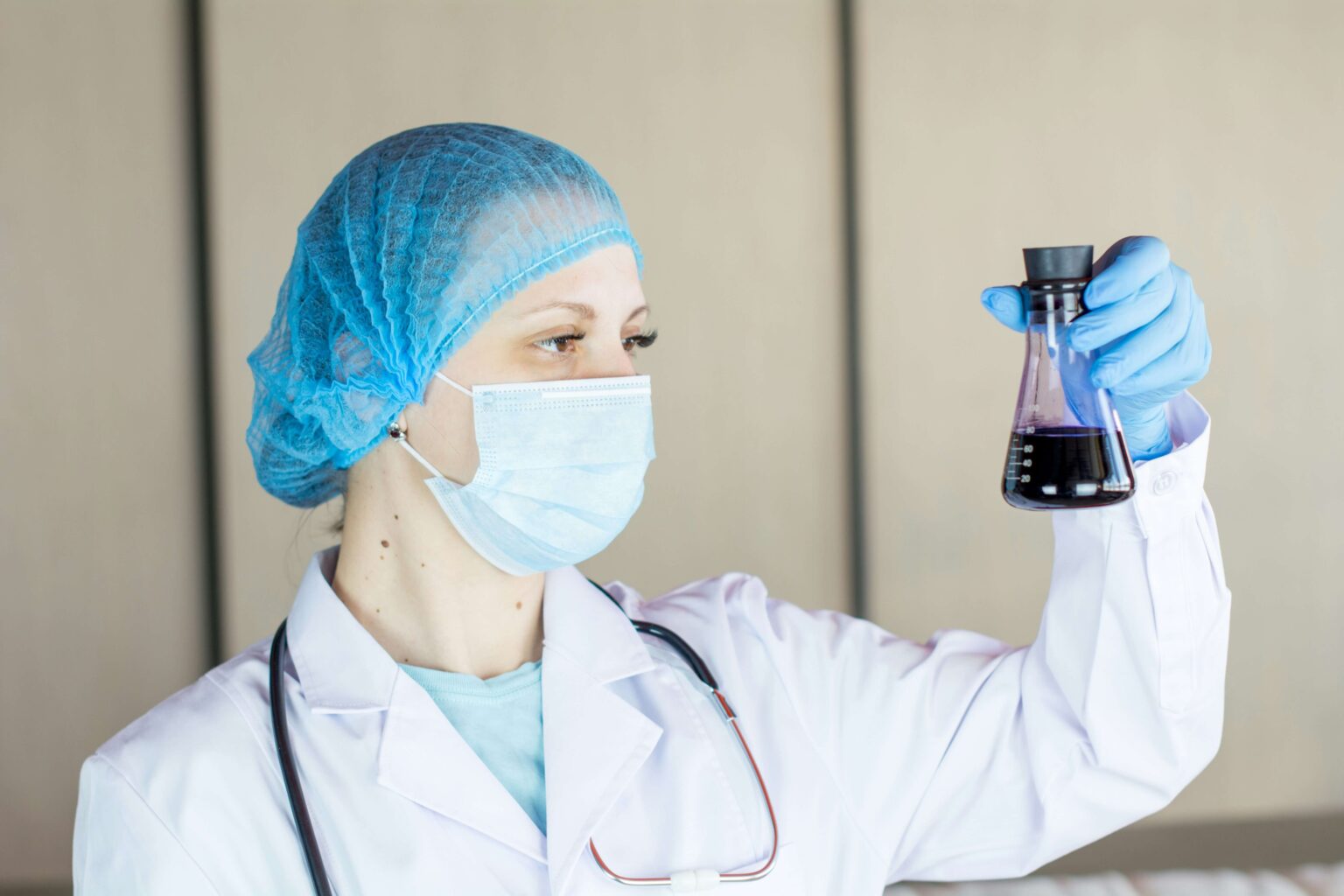 Female Scientist Looking at Test Tube in Lab - Top 10 Jobs Where Women Earn More Than Men Revealed