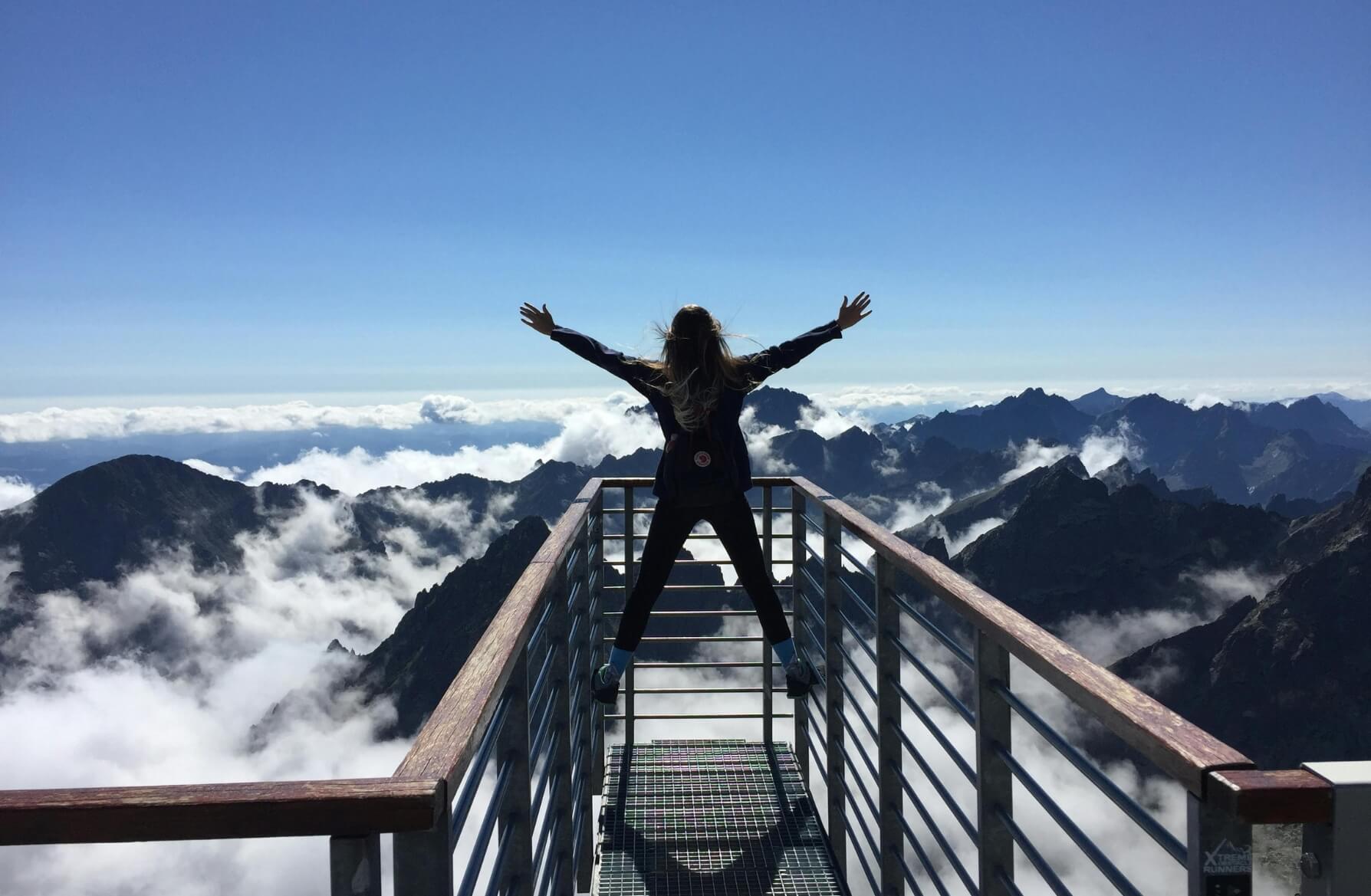 Woman Celebrating Great Heights Up Mountain - Adventure Travel For Women On The Rise