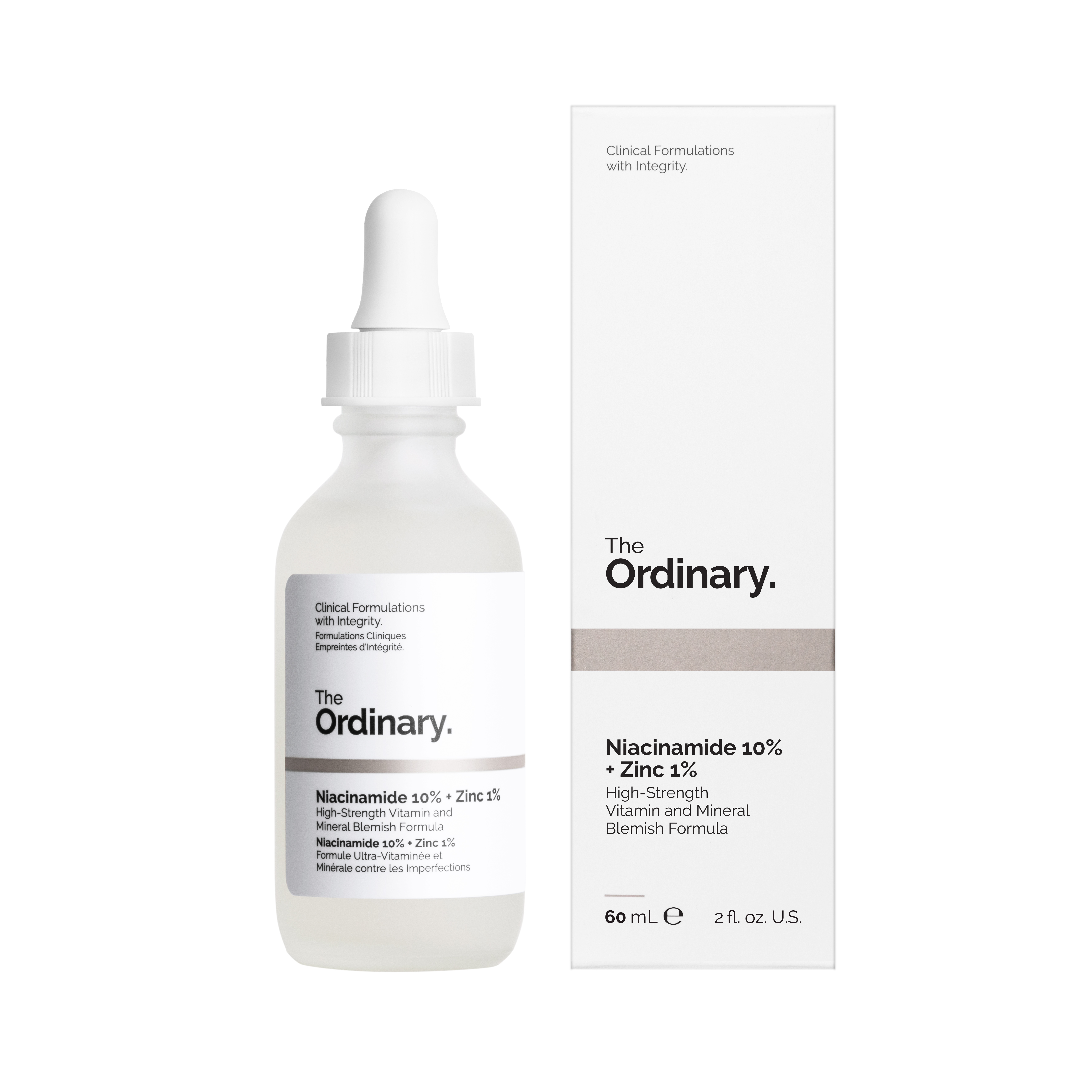 A clear glass bottle of The Ordinary serum Niacinamide 10% + Zinc 1% with white pipette next to its boxed packaging