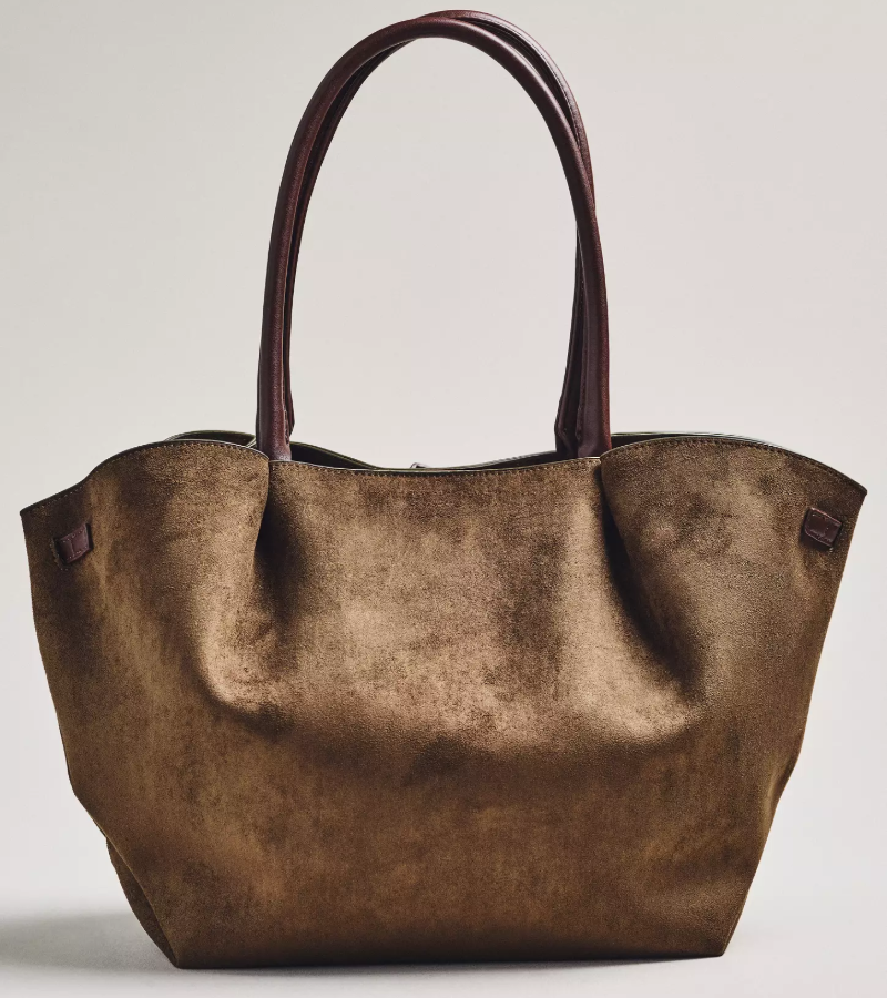 Back view of Anthropologie Faux-Suede Belted Tote Bag in brown with leather handles and front belt detail