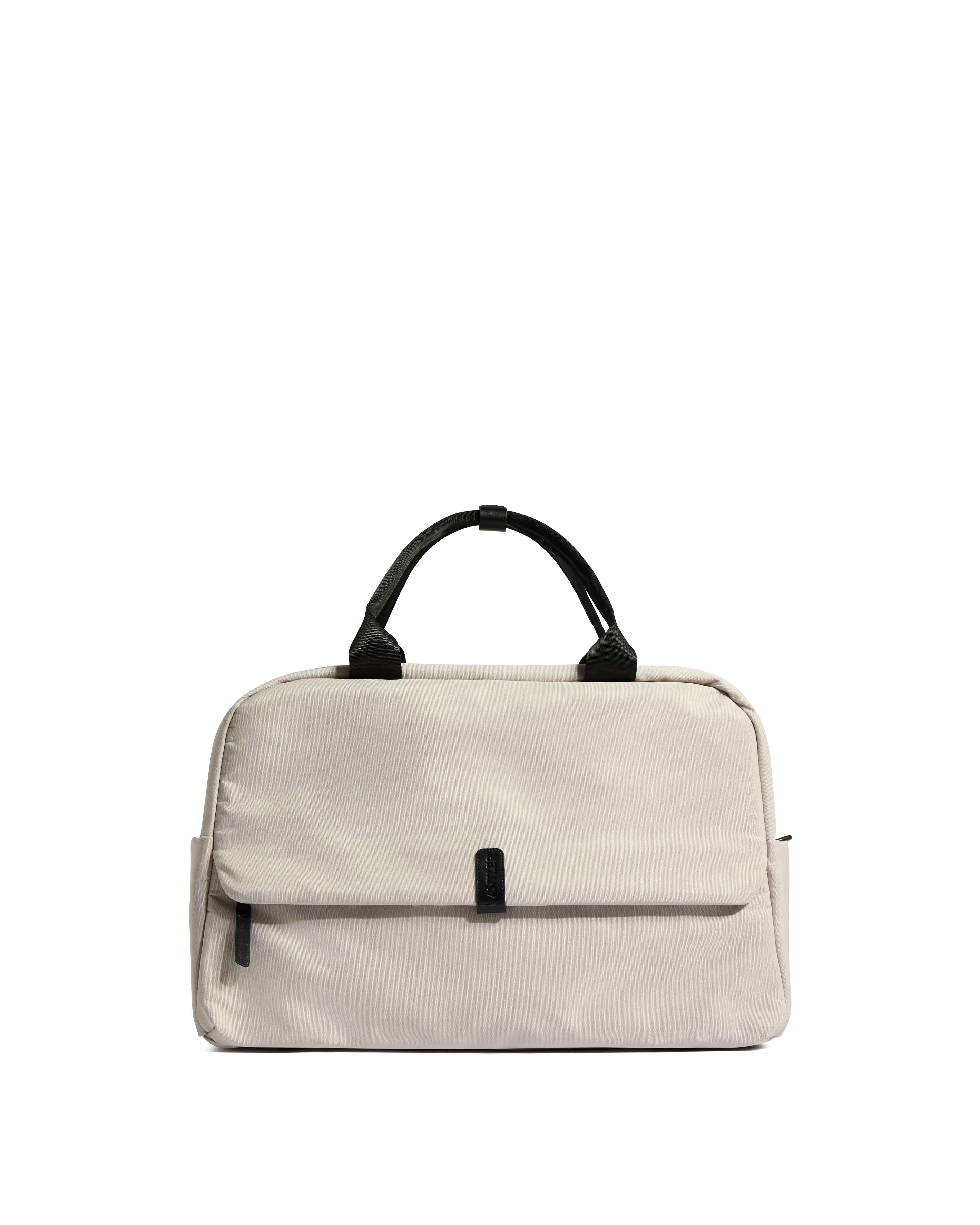 Antler Overnight Bag in taupe, a light coloured bag with black handles and a front pocket