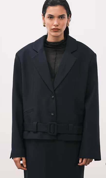 Model wearing ASOS Design super oversized belted hem blazer in navy, women's workwear blazer