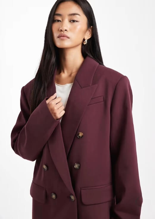 Model wearing ASOS DESIGN tailored double breasted power shoulder blazer in plum, women's oversized work blazer