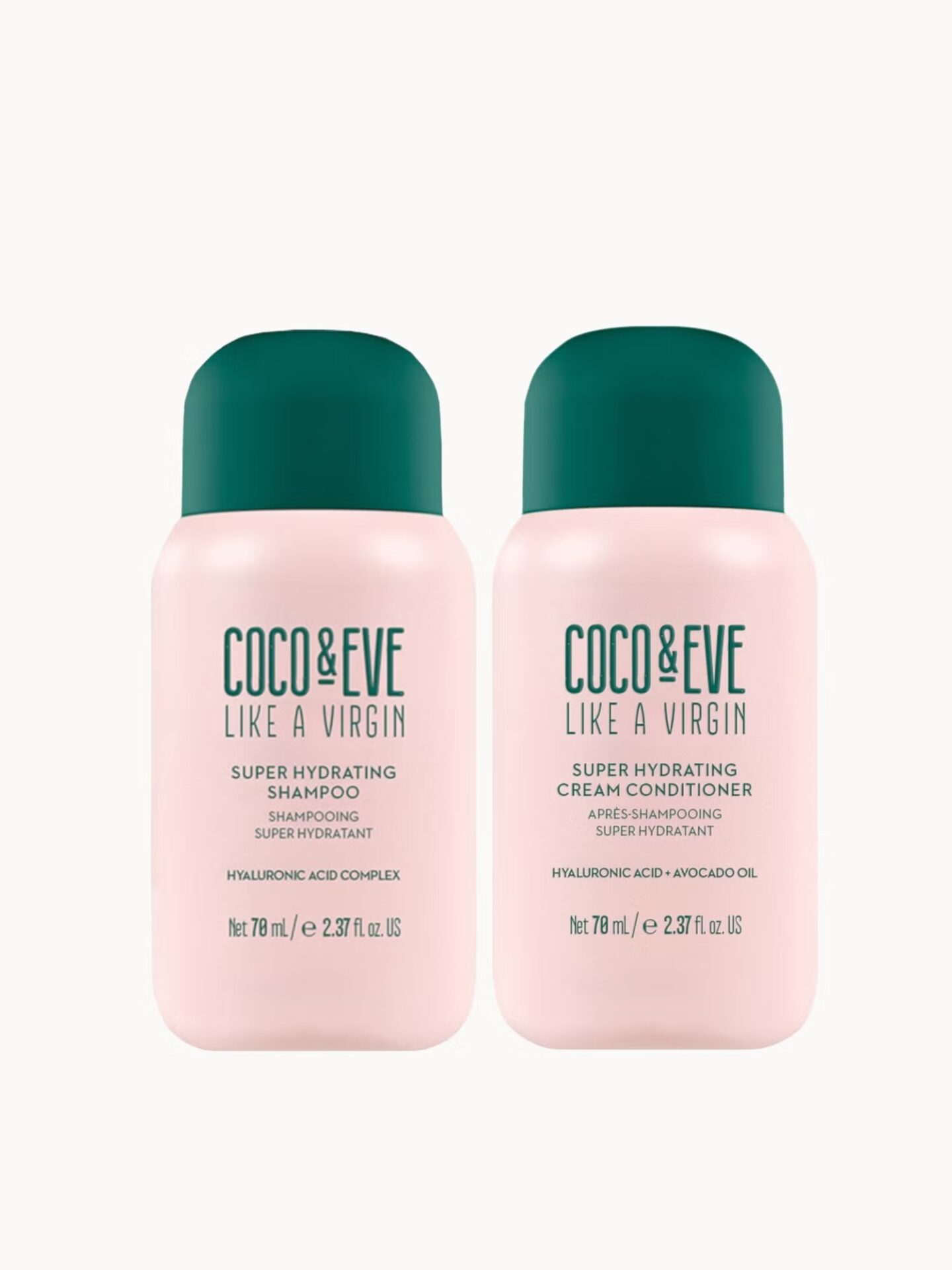 Two small pink bottles of Coco & Eve Super Hydrating Shampoo and Cream Conditioner with green caps