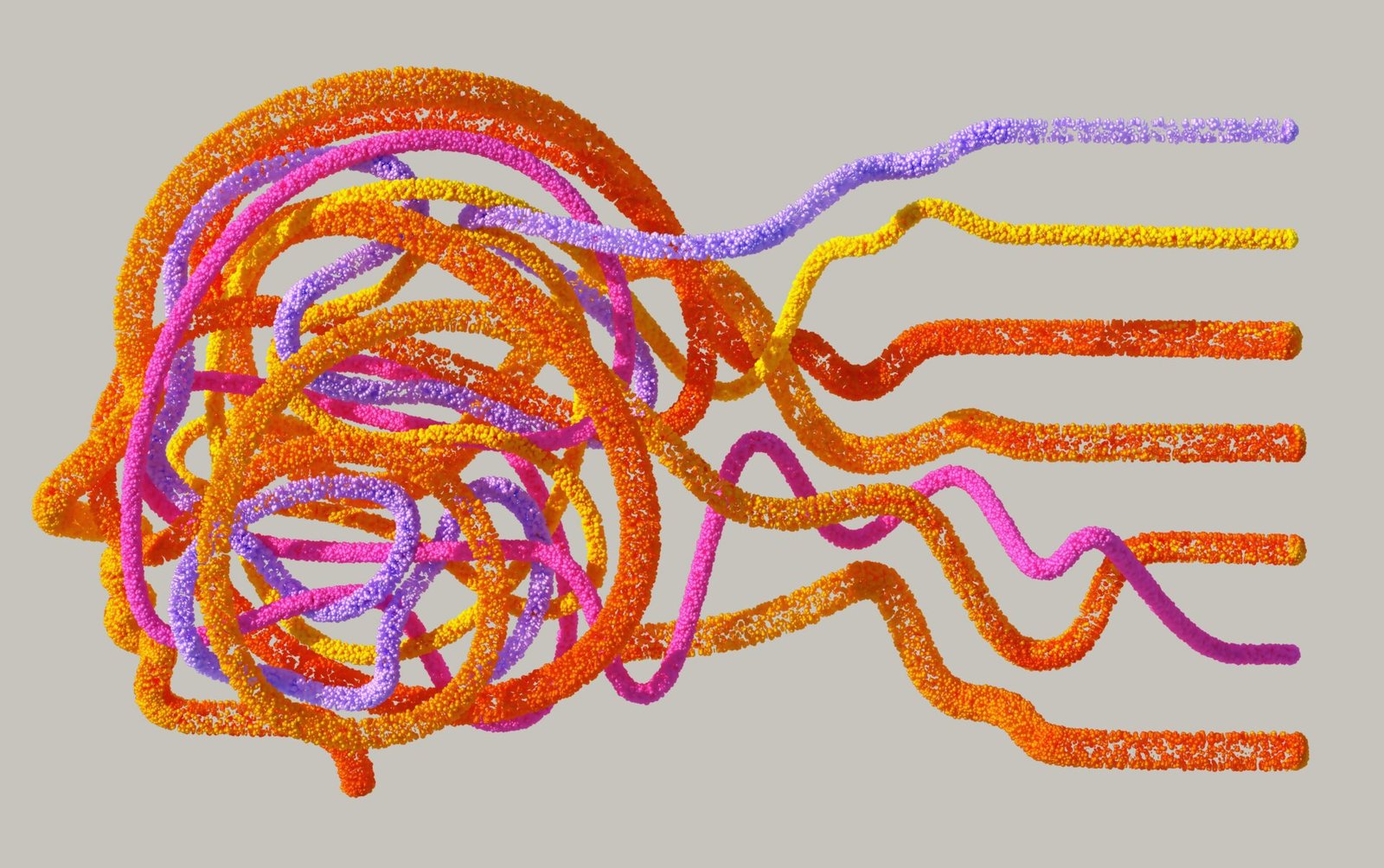 A digital illustration of a human head silhouette formed by tangled, colourful particle lines in orange, pink, and yellow against a grey background