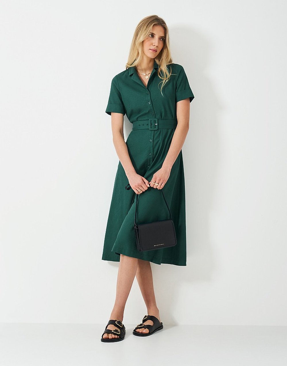 Model wearing Crew Clothing Ava Linen Blend Shirt Dress in teal, a short-sleeve dress with a belted waist and button-down front