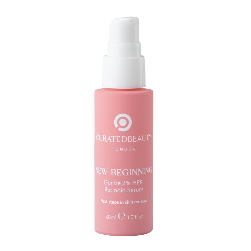 Pink bottle of Curated Beauty's New Beginning retinoid serum with a white pump top