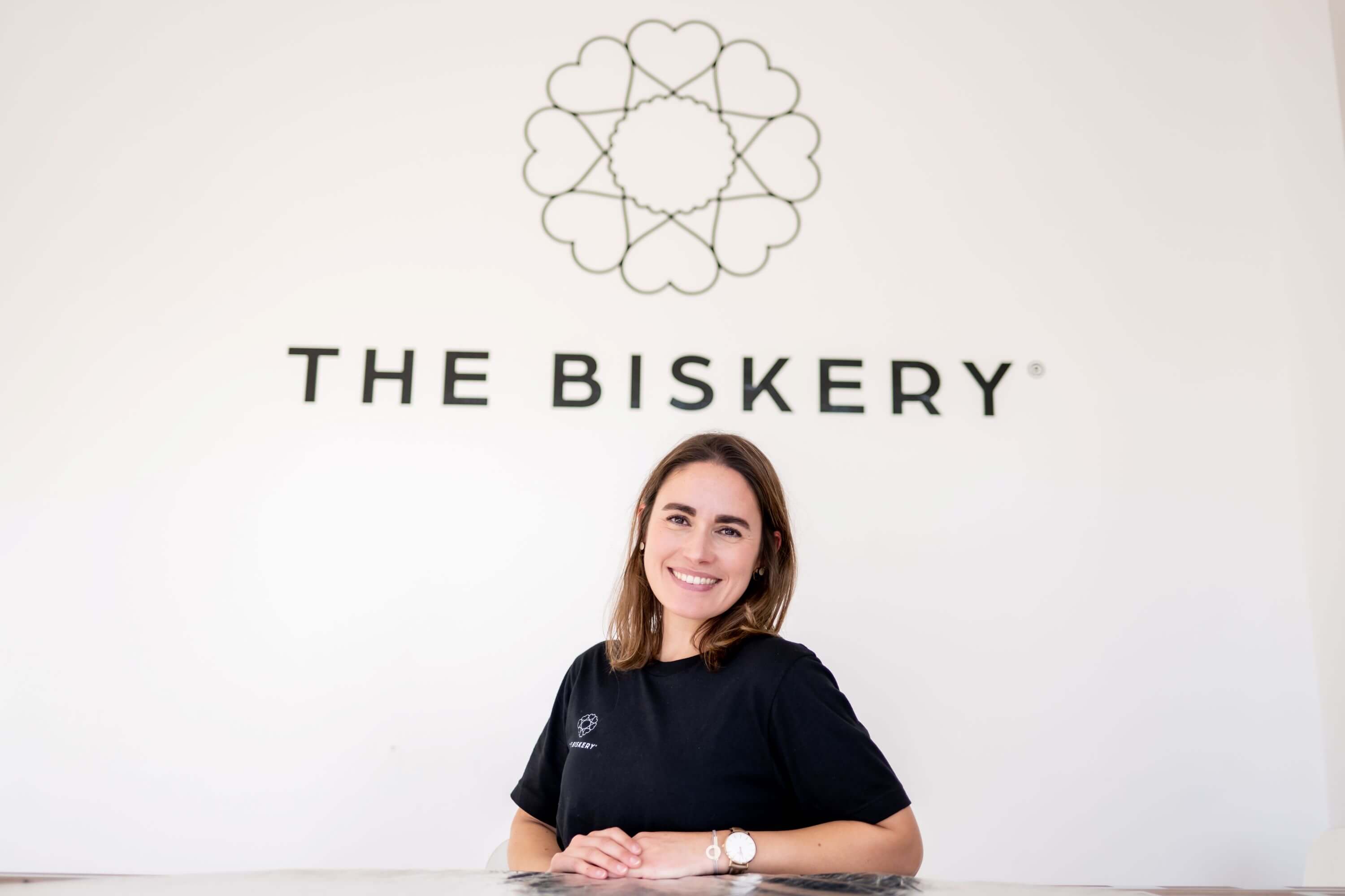 Lisa de Boer, co-founder of The Biskery, smiling inside the Leeds-based gifting company headquarters built around flexible working and motherhood