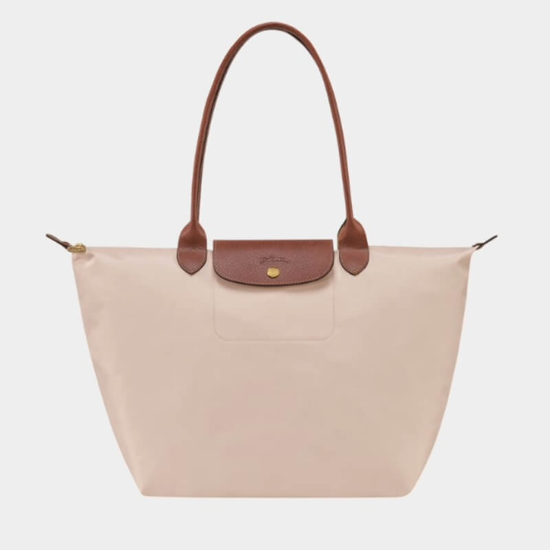 Longchamp Le Pliage Original L tote bag in paper colour with brown leather handles and flap closure.