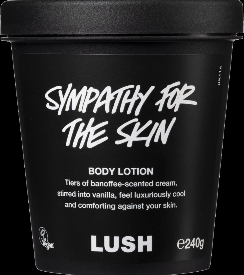 Black container of Lush's 'Sympathy for the Skin' body lotion with white text and vegan icon
