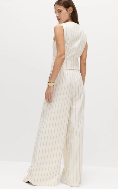 Model wearing M&S Pinstripe Wide Leg Trousers in ivory mix, showcasing the back of the trousers