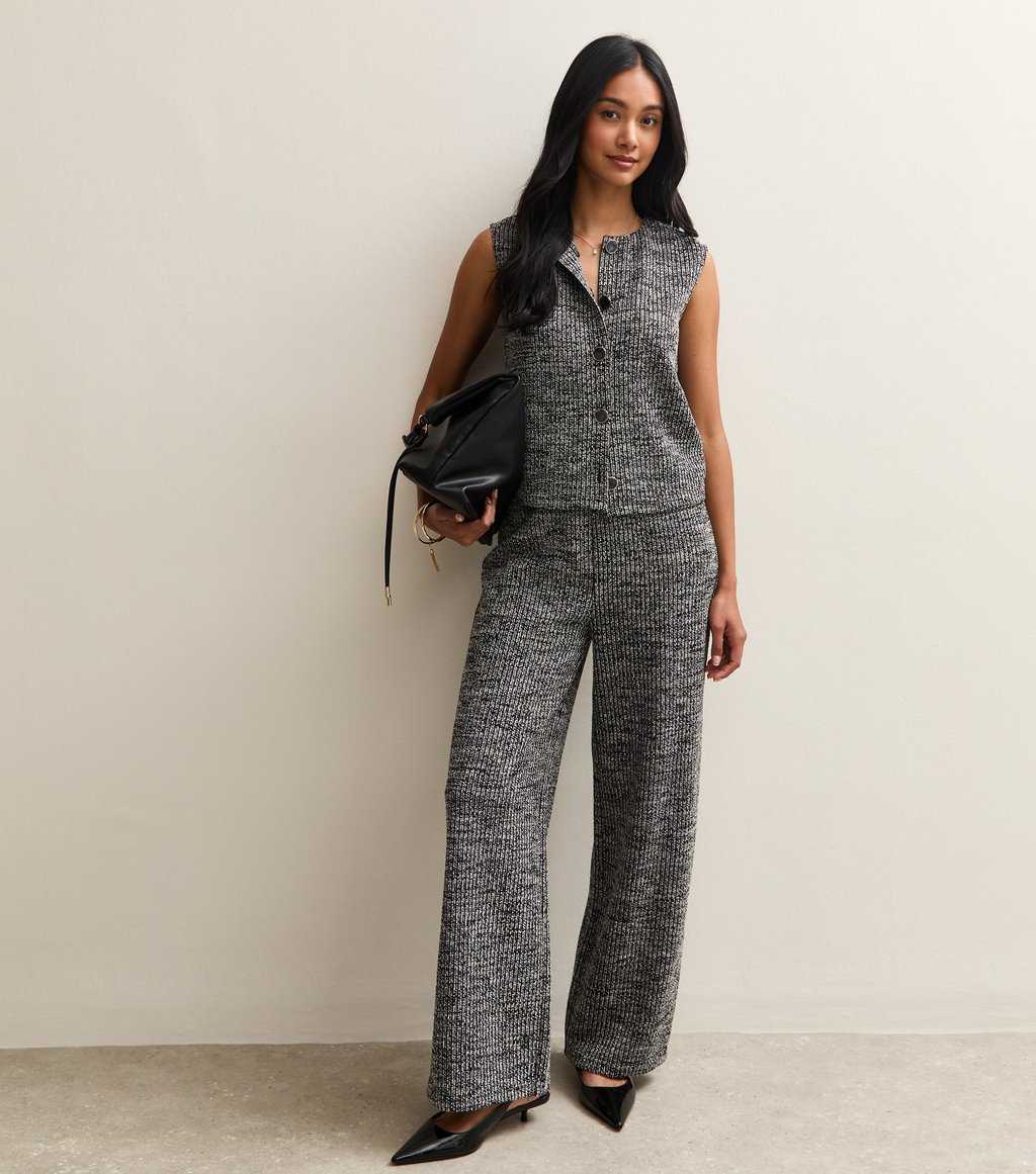 Model wearing New Look Black Soft Touch Ribbed Knit Wide Leg Trousers, soft workwear trousers for women