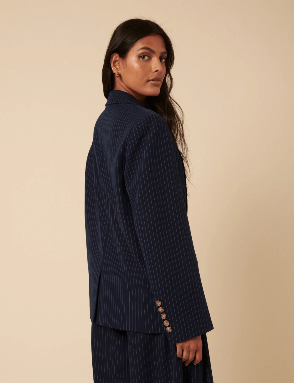 Side view of the Nobody’s Child Poppy Delevingne Navy Pinstripe Cara Blazer