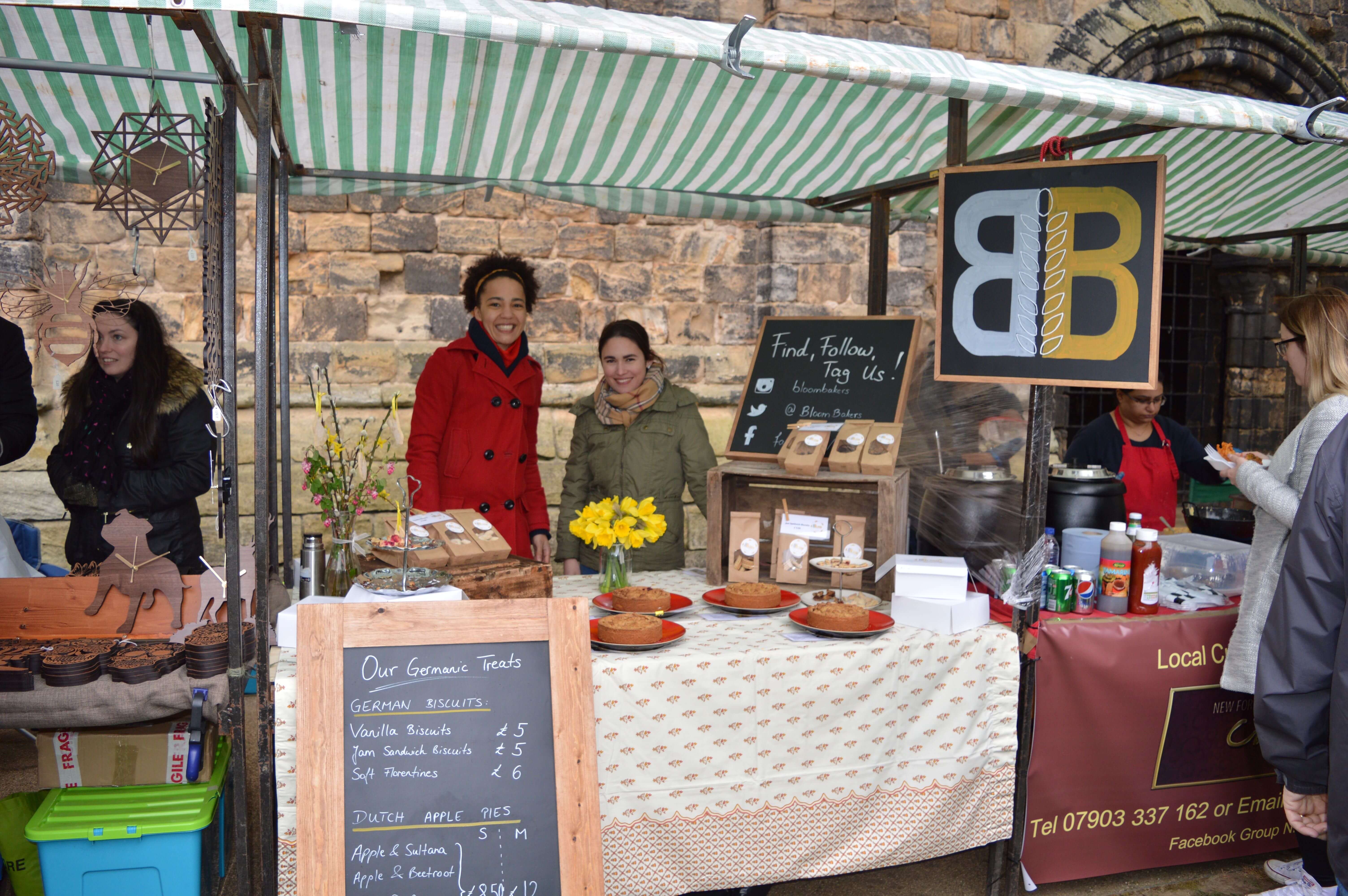 Lisa de Boer and Saskia Roskam at their original bakery market stall during the early days of building The Biskery business in Leeds
